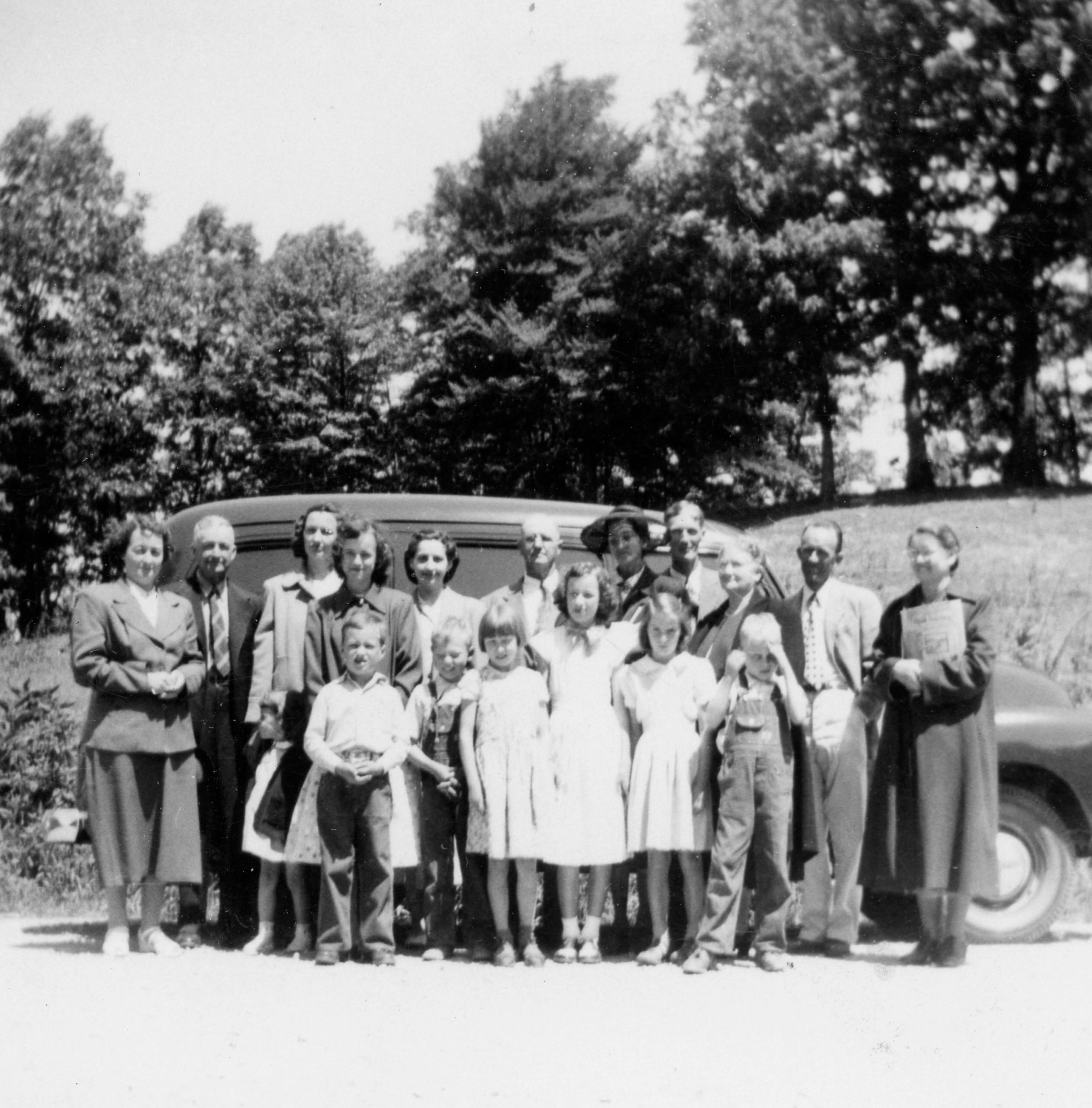 Monica Group beside the Wheeler's new bus.